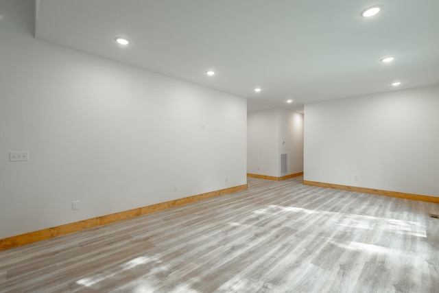 spare room with light hardwood / wood-style floors