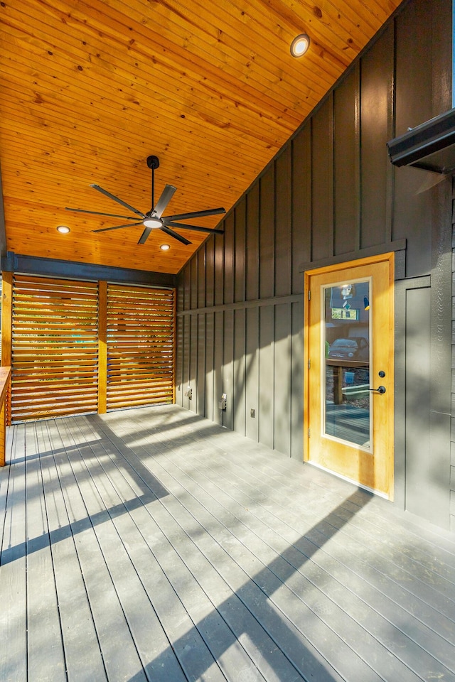 wooden deck with ceiling fan and elevator