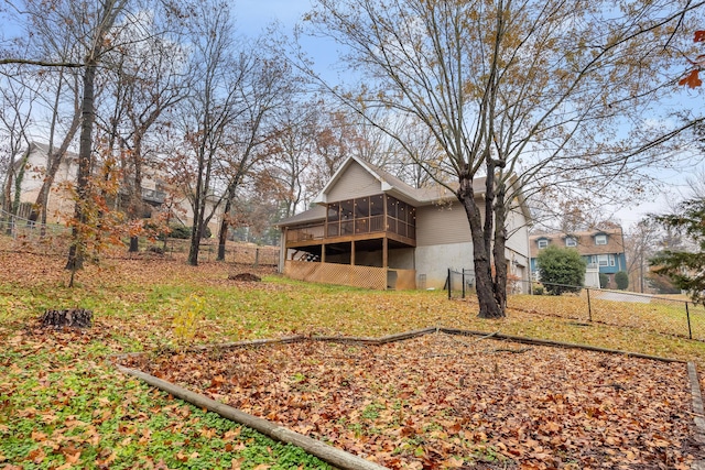 view of yard featuring a sunroom