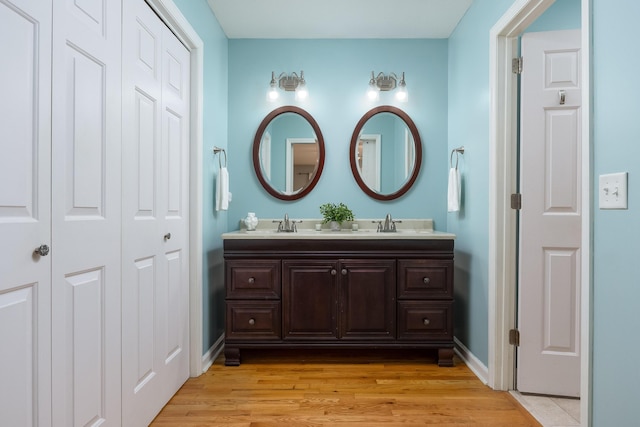 bathroom featuring wood-type flooring and vanity