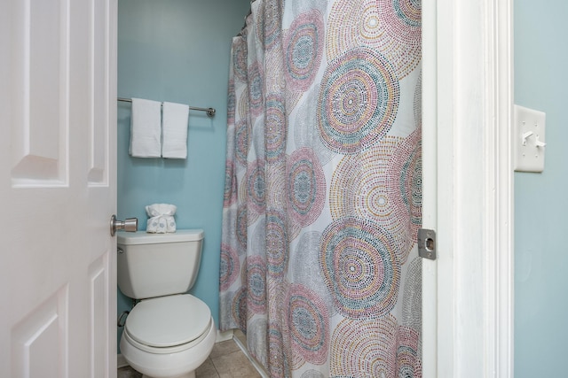 bathroom featuring toilet and tile patterned floors