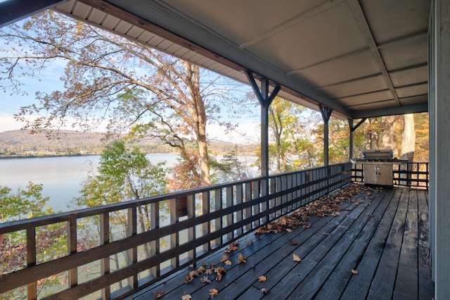 wooden deck with a water view