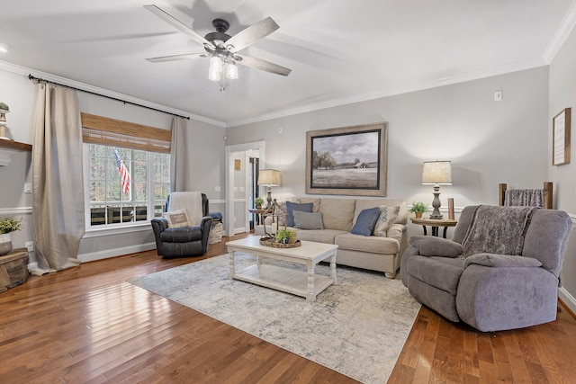 living room with ceiling fan, crown molding, and wood-type flooring