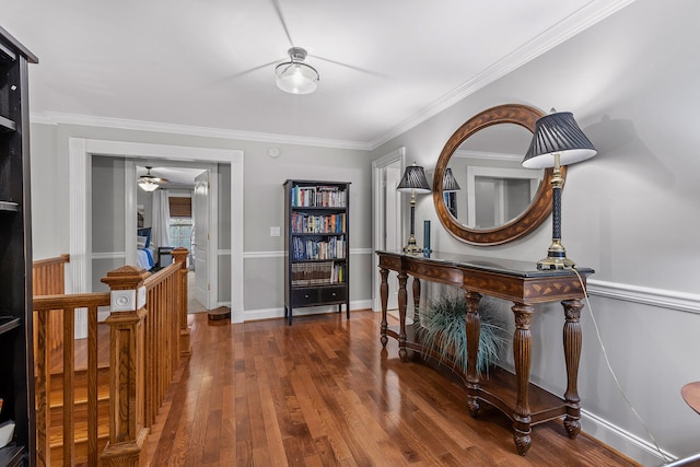 interior space with ornamental molding and dark hardwood / wood-style flooring