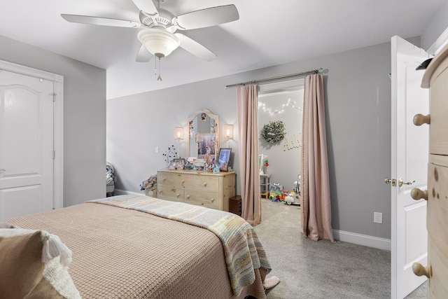 bedroom featuring light carpet and ceiling fan