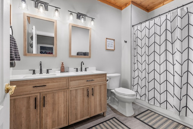 bathroom with wood ceiling, toilet, tile patterned flooring, and vanity