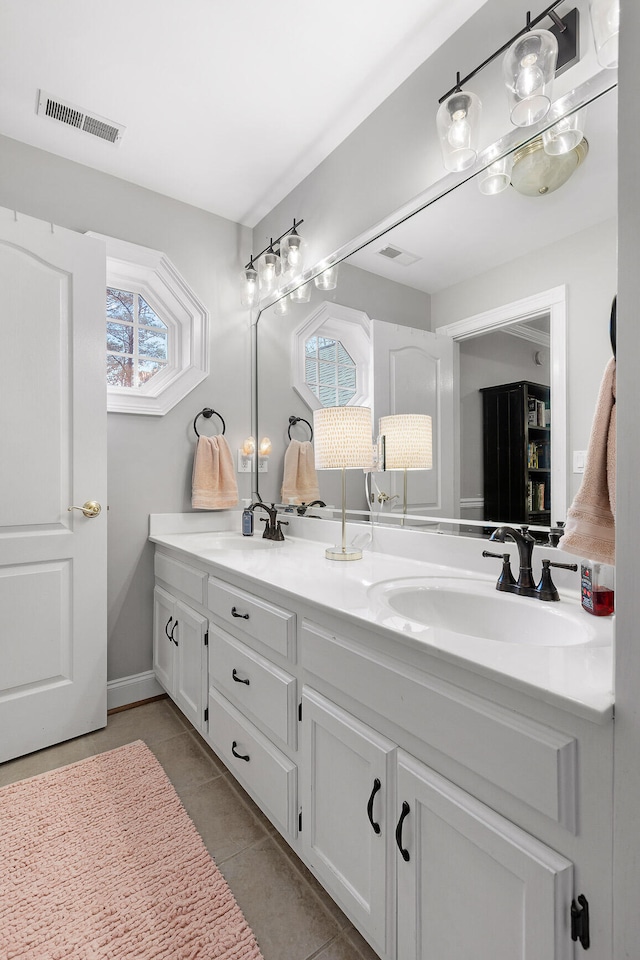 bathroom featuring tile patterned floors and vanity