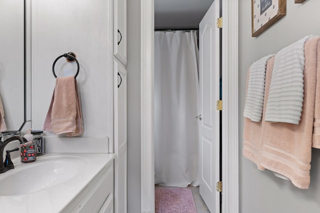 bathroom with sink and a shower with curtain