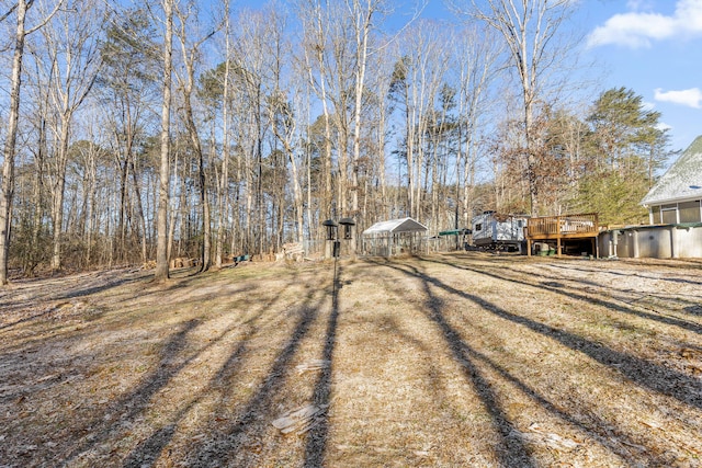 view of yard featuring a wooden deck