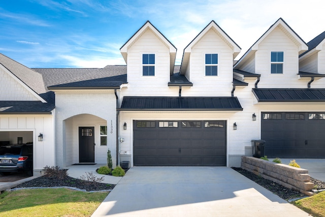 modern inspired farmhouse featuring a garage