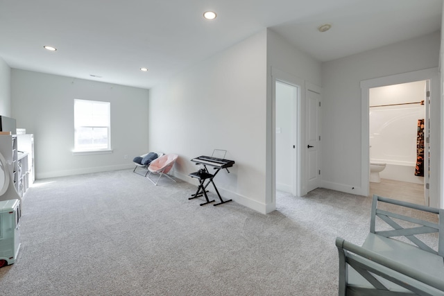 living area with light colored carpet