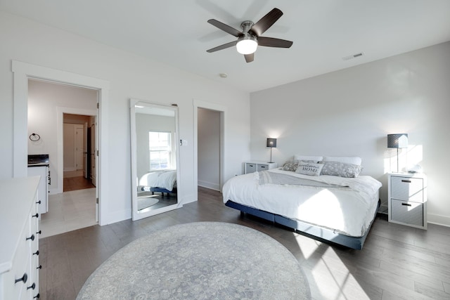 bedroom with ceiling fan and dark hardwood / wood-style flooring