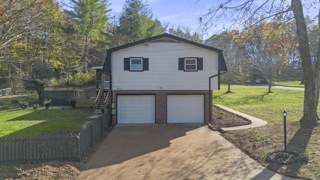 view of side of property featuring a garage, a wooden deck, and a lawn