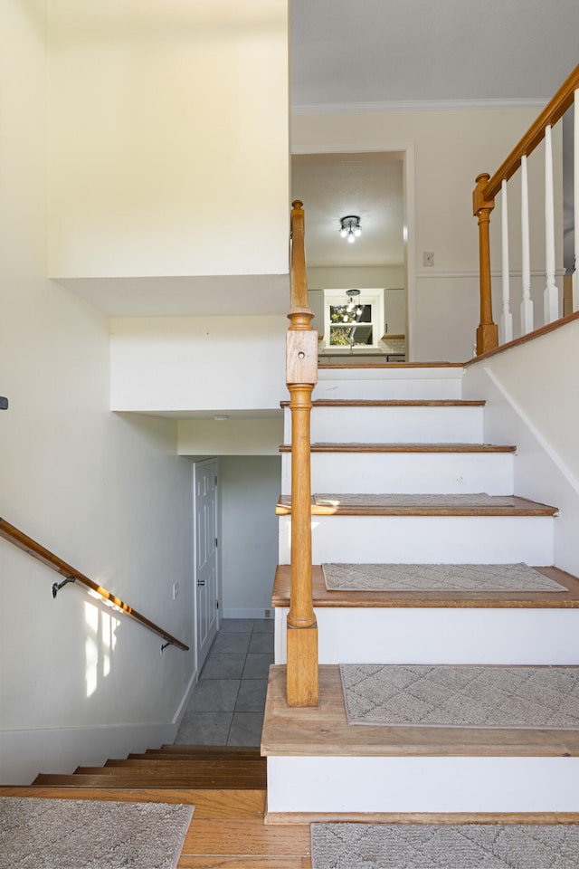 stairs featuring hardwood / wood-style flooring