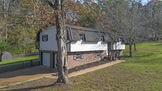 view of side of home with a yard and a garage