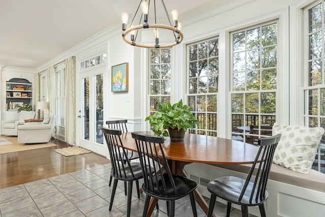 sunroom with an inviting chandelier