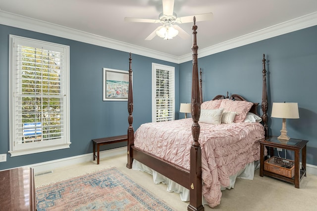 bedroom with ceiling fan, carpet floors, crown molding, and multiple windows