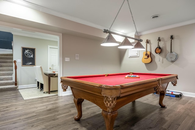 recreation room featuring billiards, ornamental molding, and hardwood / wood-style flooring