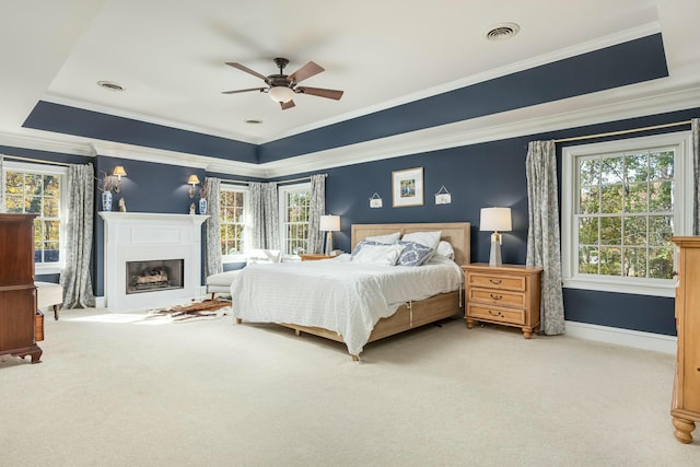 bedroom featuring light carpet, ceiling fan, and ornamental molding