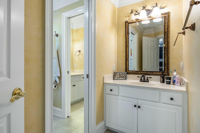 bathroom featuring tile patterned floors, crown molding, and vanity