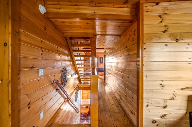 interior space featuring wooden ceiling, hardwood / wood-style flooring, and wooden walls