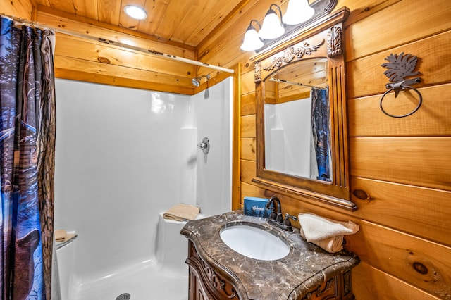 bathroom featuring wood walls, toilet, vanity, wood ceiling, and a shower with shower curtain