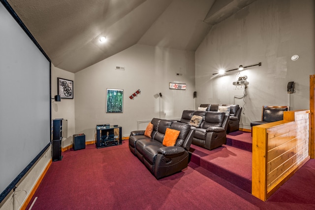 carpeted home theater with vaulted ceiling