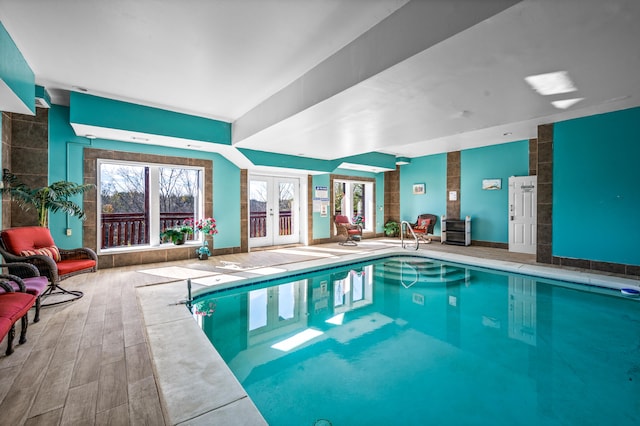 view of pool with french doors