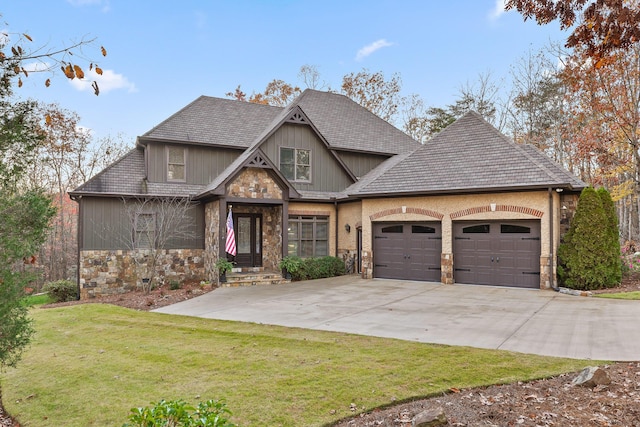 craftsman-style house with a garage and a front yard