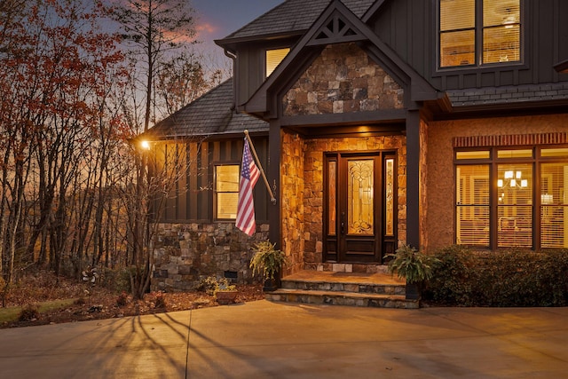 view of exterior entry at dusk