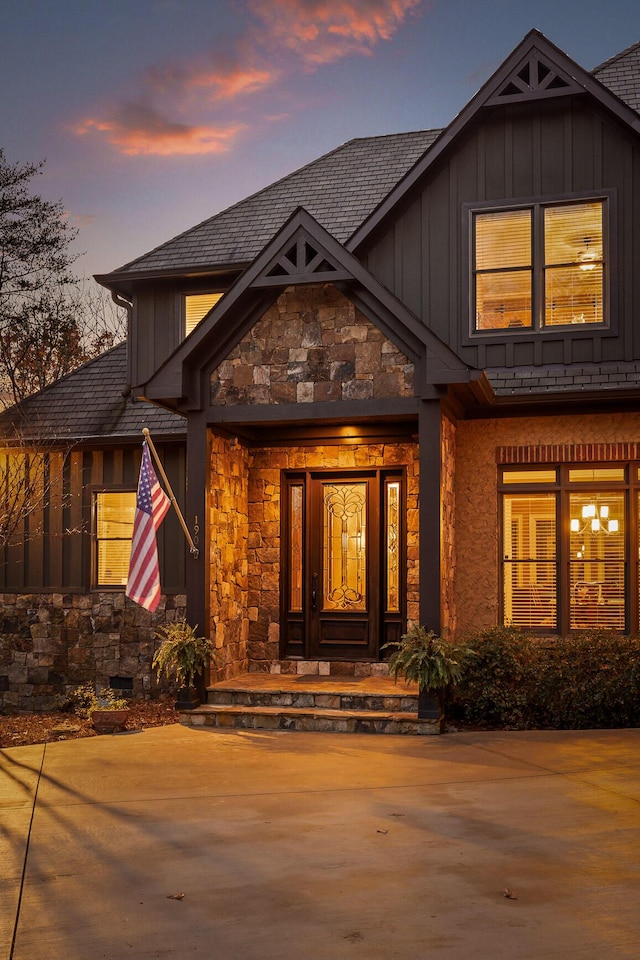 view of exterior entry at dusk