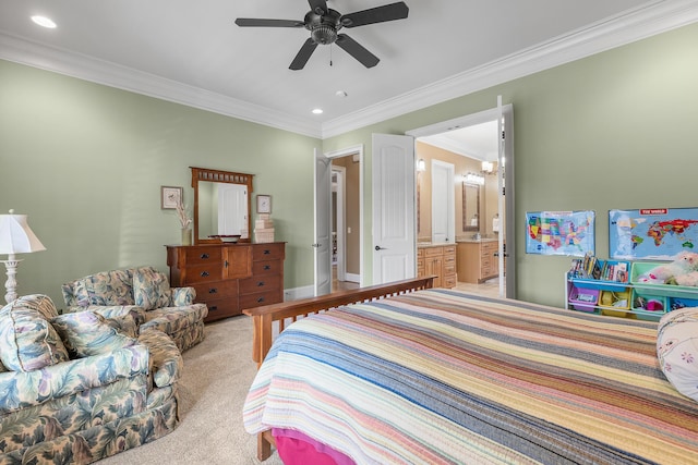 carpeted bedroom featuring connected bathroom, ceiling fan, and crown molding