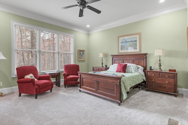 bedroom with ceiling fan, light carpet, and multiple windows