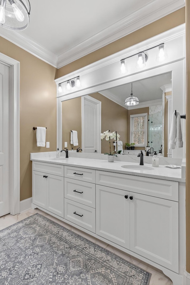 bathroom featuring vanity, a shower with shower door, and ornamental molding