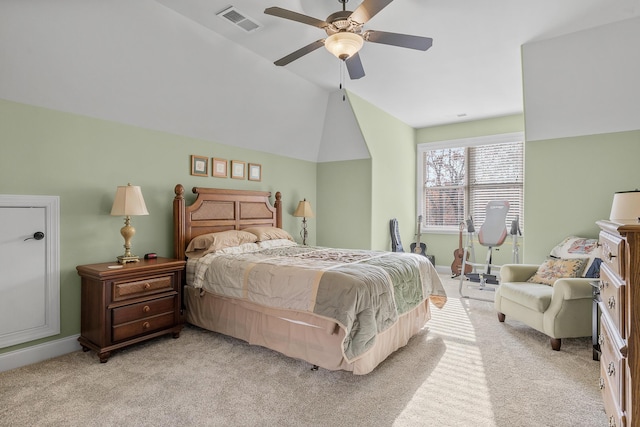 bedroom with ceiling fan, lofted ceiling, and light carpet