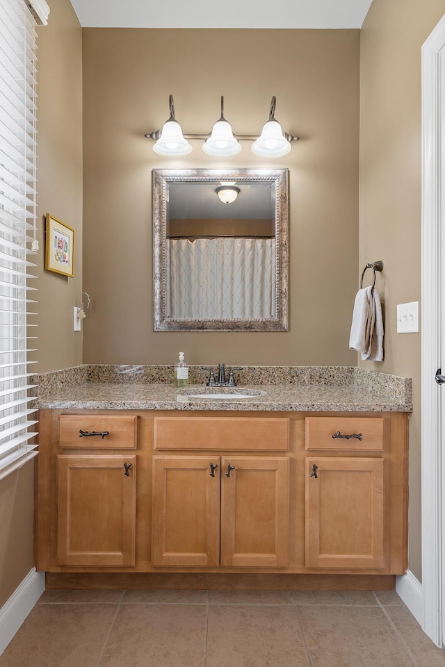 bathroom featuring tile patterned flooring, vanity, and a shower with shower curtain