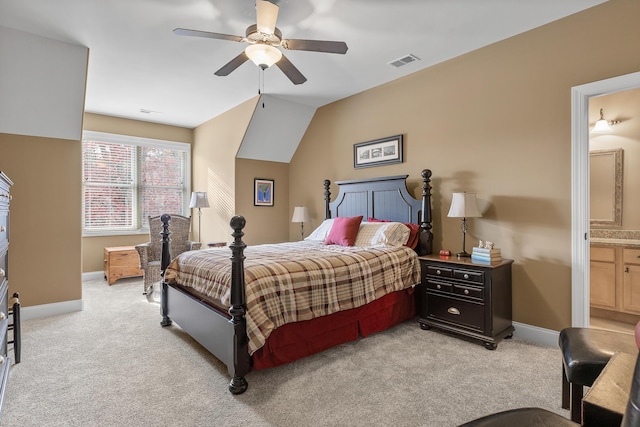 carpeted bedroom featuring ensuite bathroom, ceiling fan, and lofted ceiling