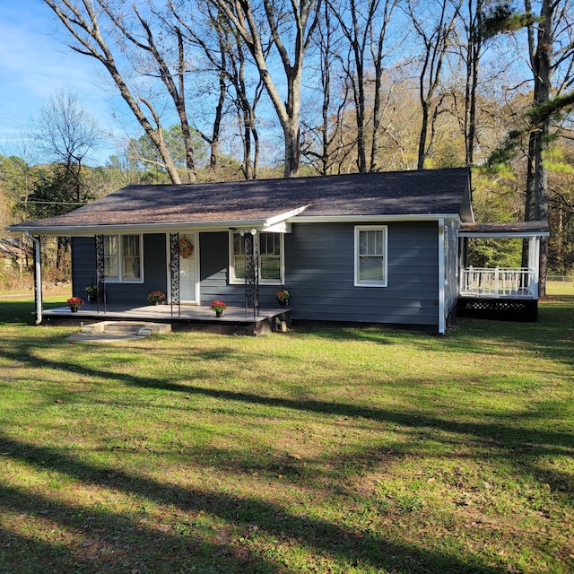 single story home featuring covered porch and a front lawn