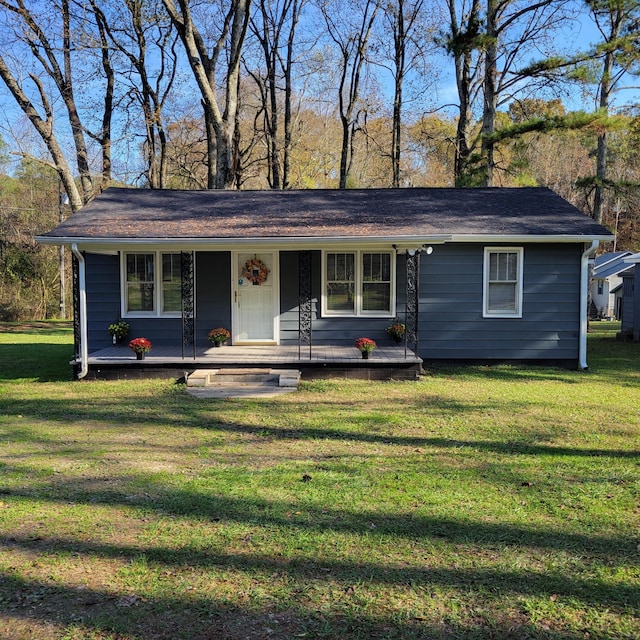 ranch-style home with a front lawn and covered porch