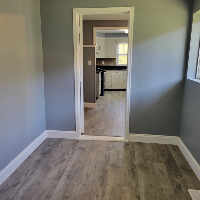 unfurnished room with light hardwood / wood-style flooring