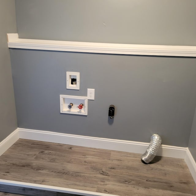 laundry area featuring hookup for a washing machine, hardwood / wood-style floors, and hookup for an electric dryer