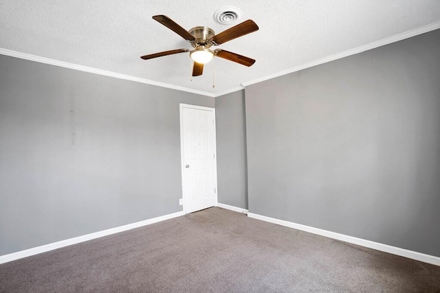 carpeted spare room featuring a textured ceiling, ceiling fan, and crown molding