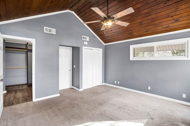 unfurnished bedroom featuring carpet flooring, high vaulted ceiling, ceiling fan, and wooden ceiling