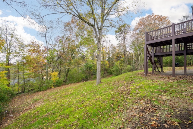 view of yard featuring a wooden deck