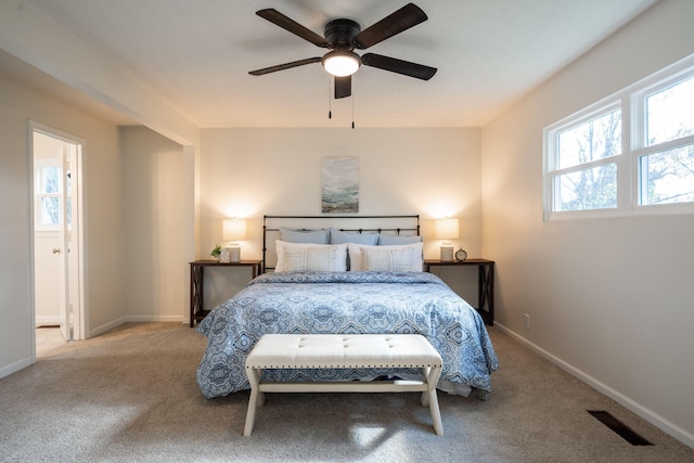 bedroom with ceiling fan and light colored carpet