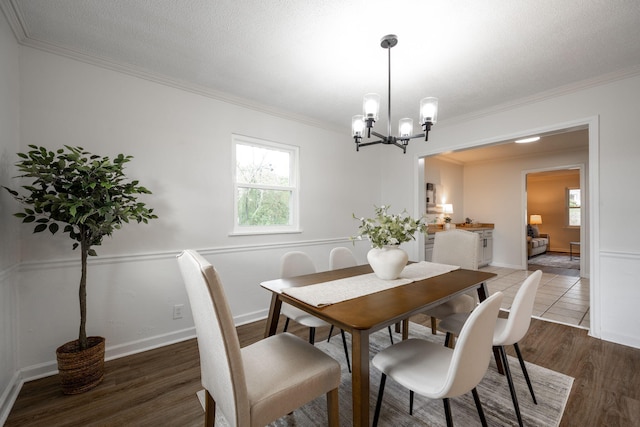 9100 Coventry Ln, Chattanooga, TN 37416 - dining room with a chandelier, plenty of natural light, crown molding, and wood finished floors