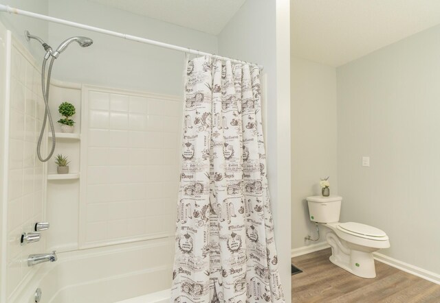 bathroom featuring toilet, shower / bathtub combination with curtain, wood finished floors, and baseboards