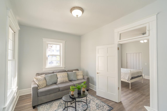 living room with wood finished floors and baseboards