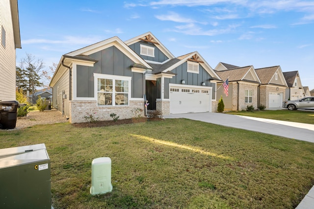 view of front of house with a front yard and a garage