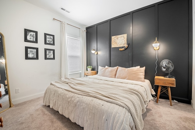 bedroom featuring light carpet